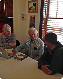 Men discussing decision making with Allen Savory